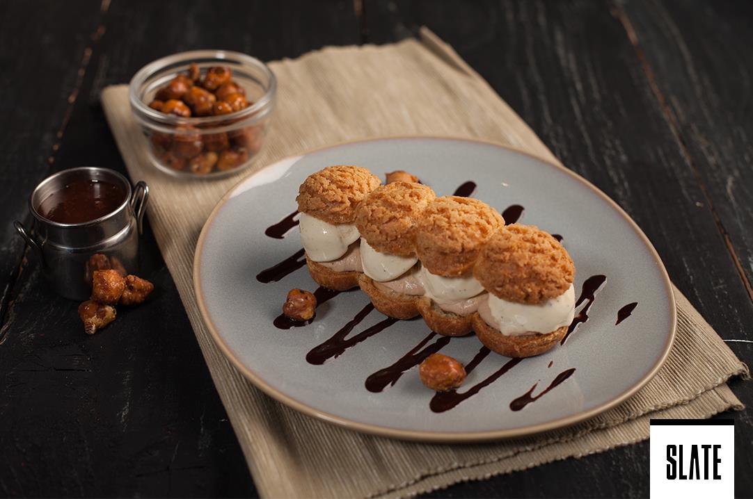 Indulge in our Cocoon Profiteroles! Made with our Homemade Vanilla Ice Cream and Gianduja Cream!